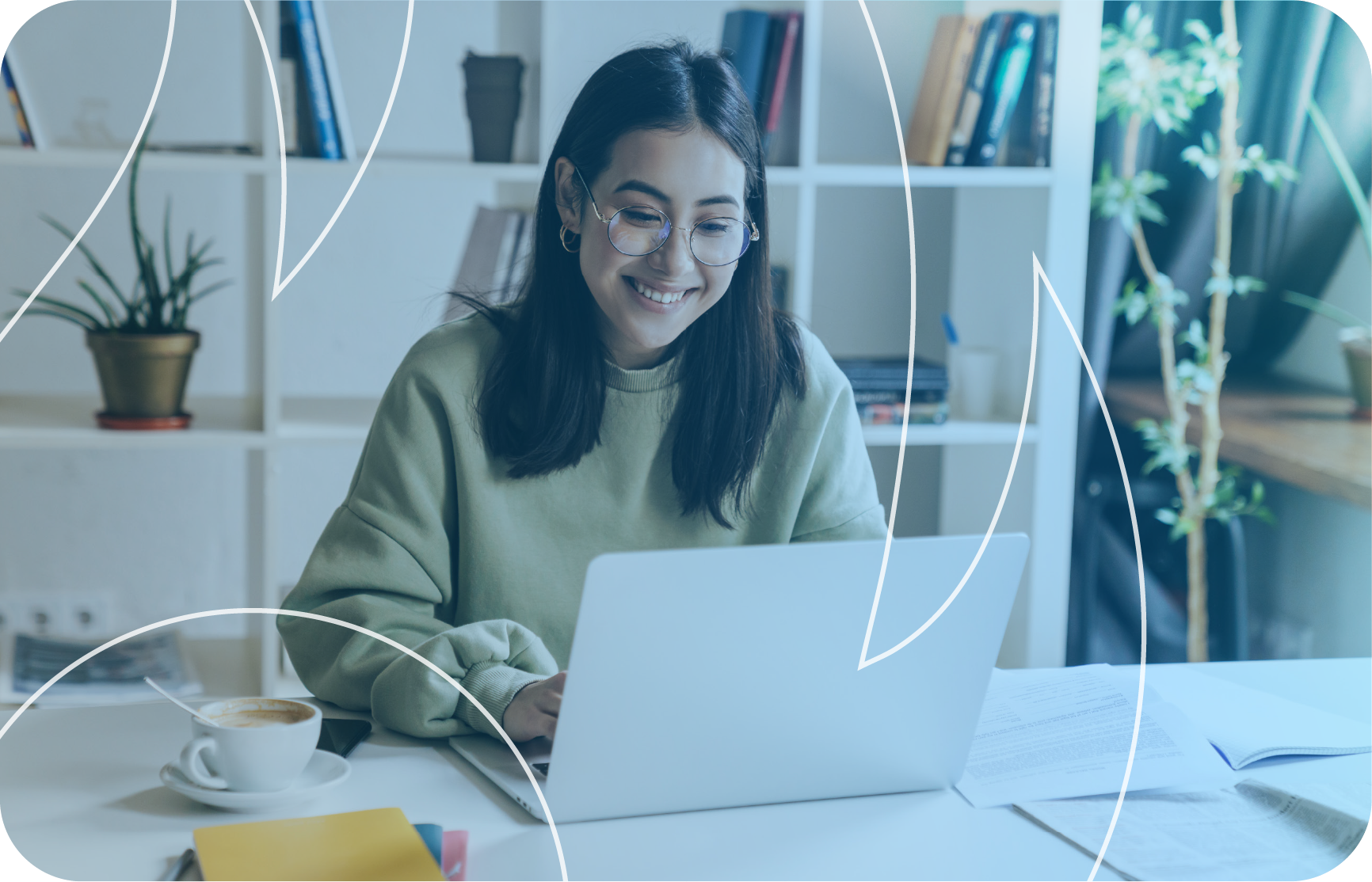 Women smiling looking at her laptop